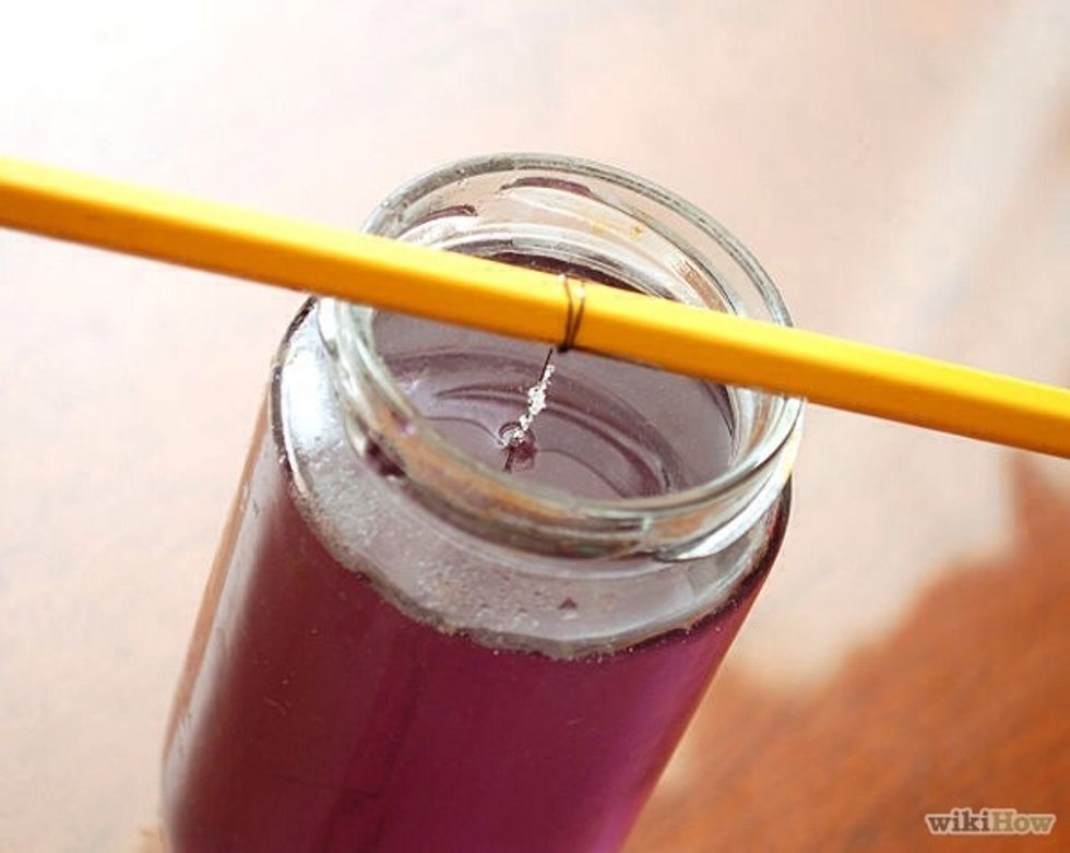 Leave the string in the solution until the crystals are big enough for your liking or they have completely stopped growing.