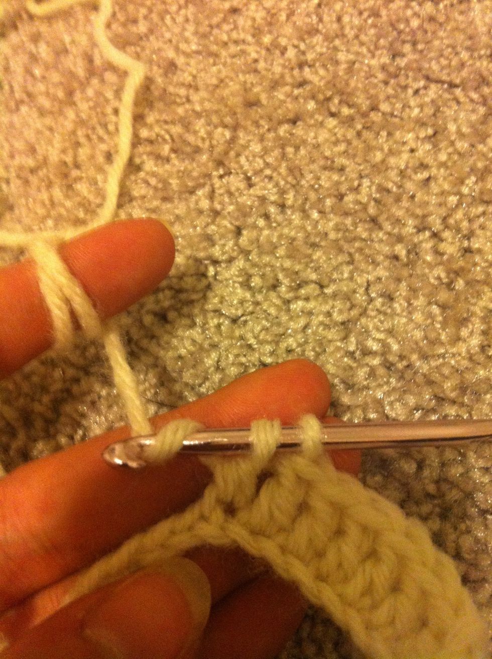 leave this stitch unfinished with 2 loops left on the hook. yarn around again and start a new double crochet in the next chain.