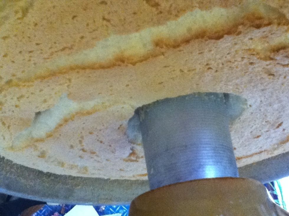 Leave your cake upside down until it is COMPLETELY cool. This will take a few hours.
