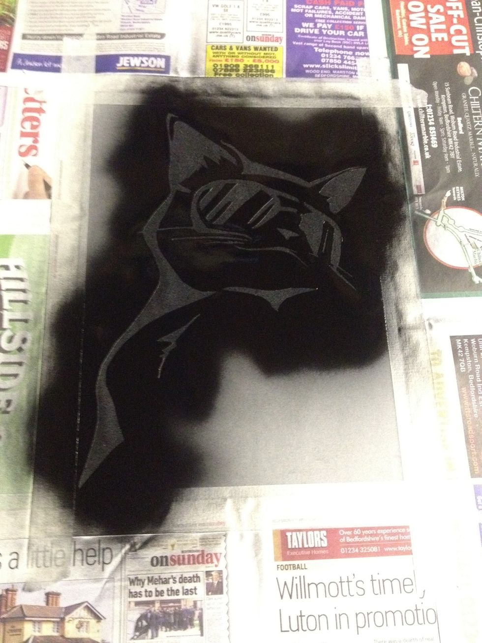 Leave your shirt to dry. Be careful not to move the stencil at all, you'll have a hard time trying to put it back in the exact same place (this is part of why we used the spray glue).