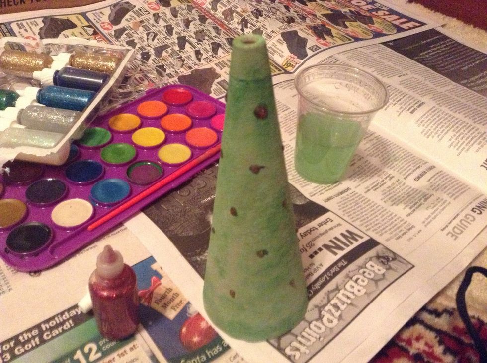 Leaving an inch on the top and bottom, add red dots of glitter glue evenly. My rows went 3-4-4-4-4.