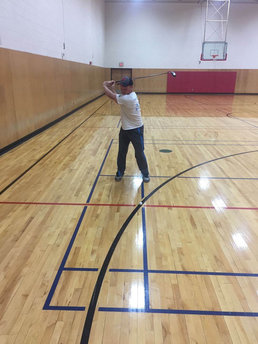 Left arm should be straight with the head of the club pointing towards the target