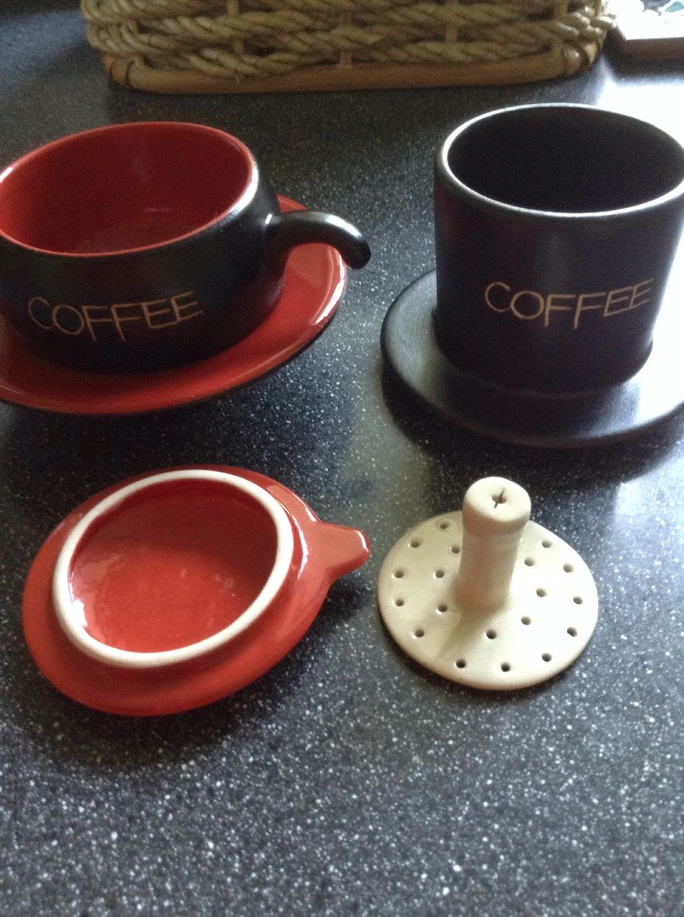 Left to right, clockwise: cup with saucer, coffee dripper (where you put the ground coffee into), coffee presser, and dripper cover.