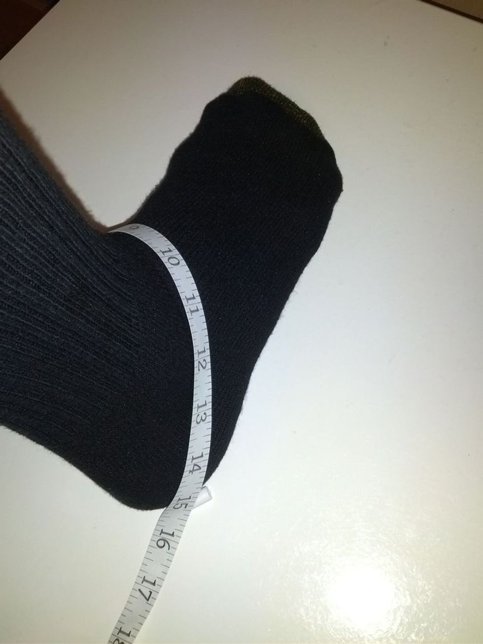 Leg Opening - Wrap the measuring tape around the bottom of your heel to the top of your ankle in a diagonal fashion. In this case my leg opening measurement is 15".