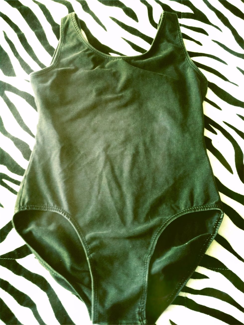 Leotards are vital to serious dancers but amateurs can possibly get away with tanks. Black helps show your center and leotards help to see your rib placement