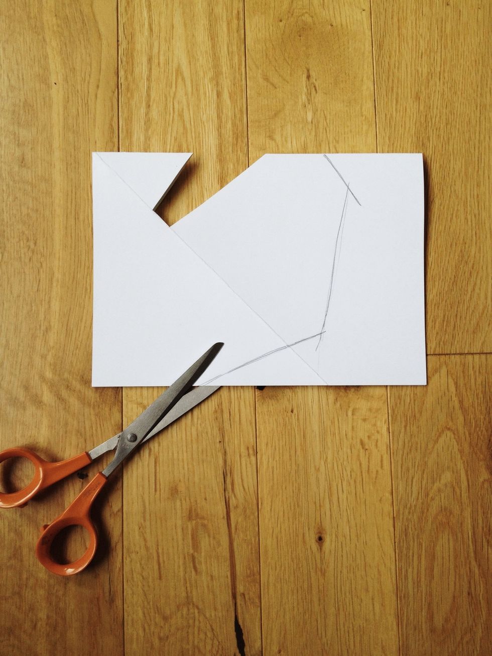 Less is more: trim off the end as shown. Doesn't need to be exact. My sheet of paper was a little too long. Just leave at least 3cm after the phone slot.