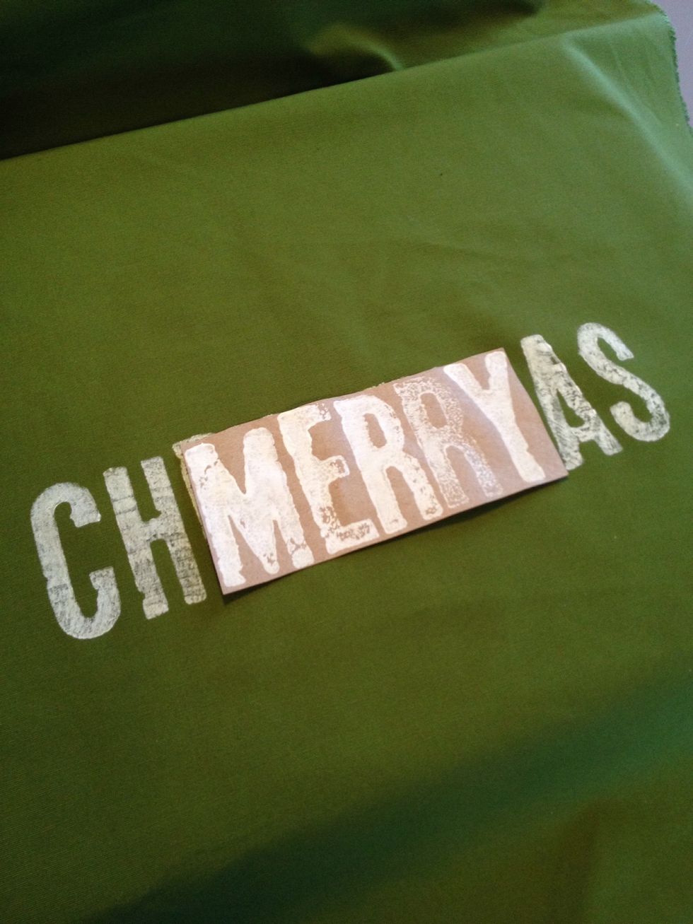 Let "Christmas" dry completely. Once dry center the "merry" guide over the center of the stamped "Christmas", then stamp.