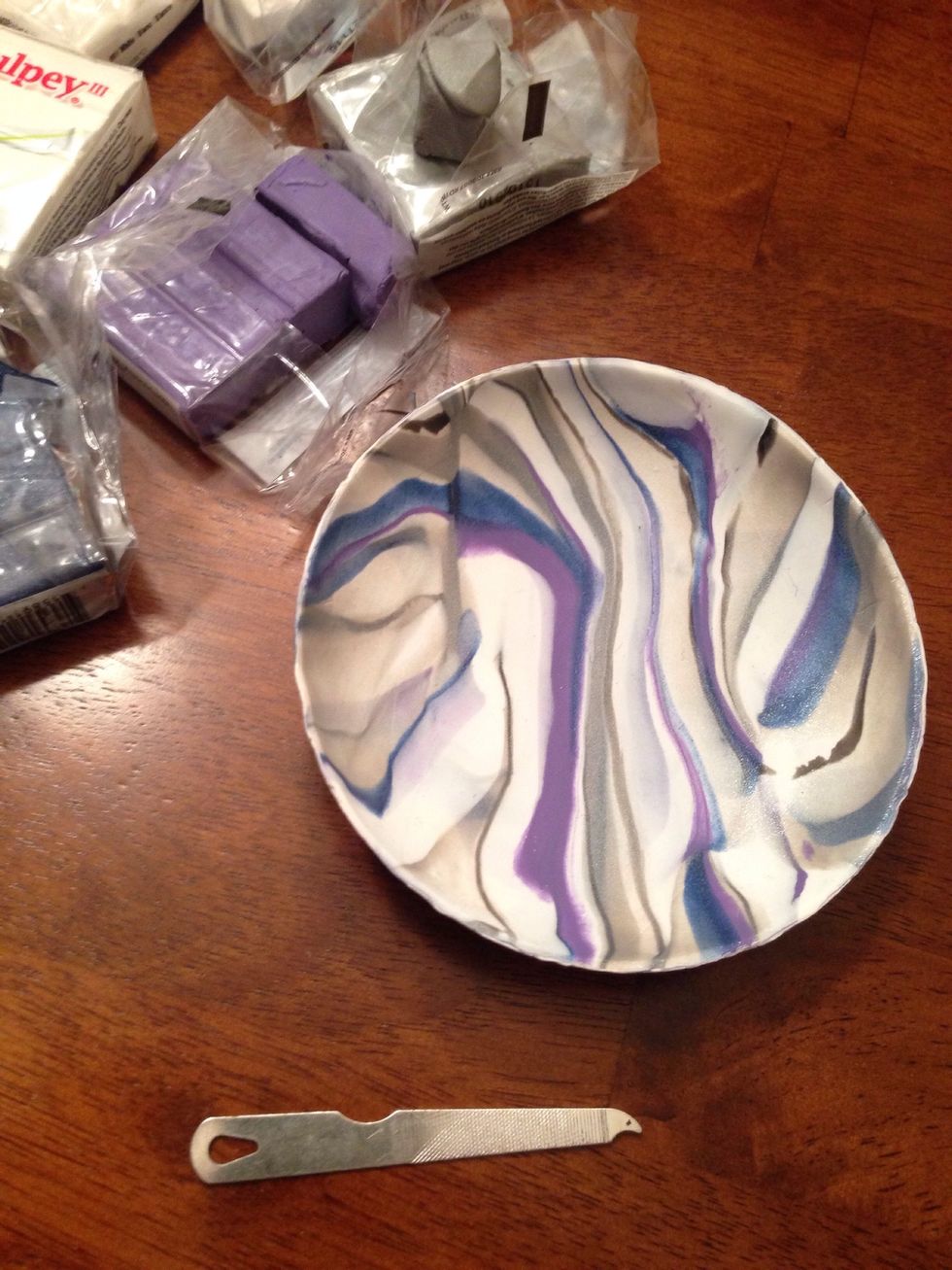 Let dish cool. Use a butter knife or flip your oven safe dish upside down to get your clay dish out. Sand edges down. -I used a nail file tool-
