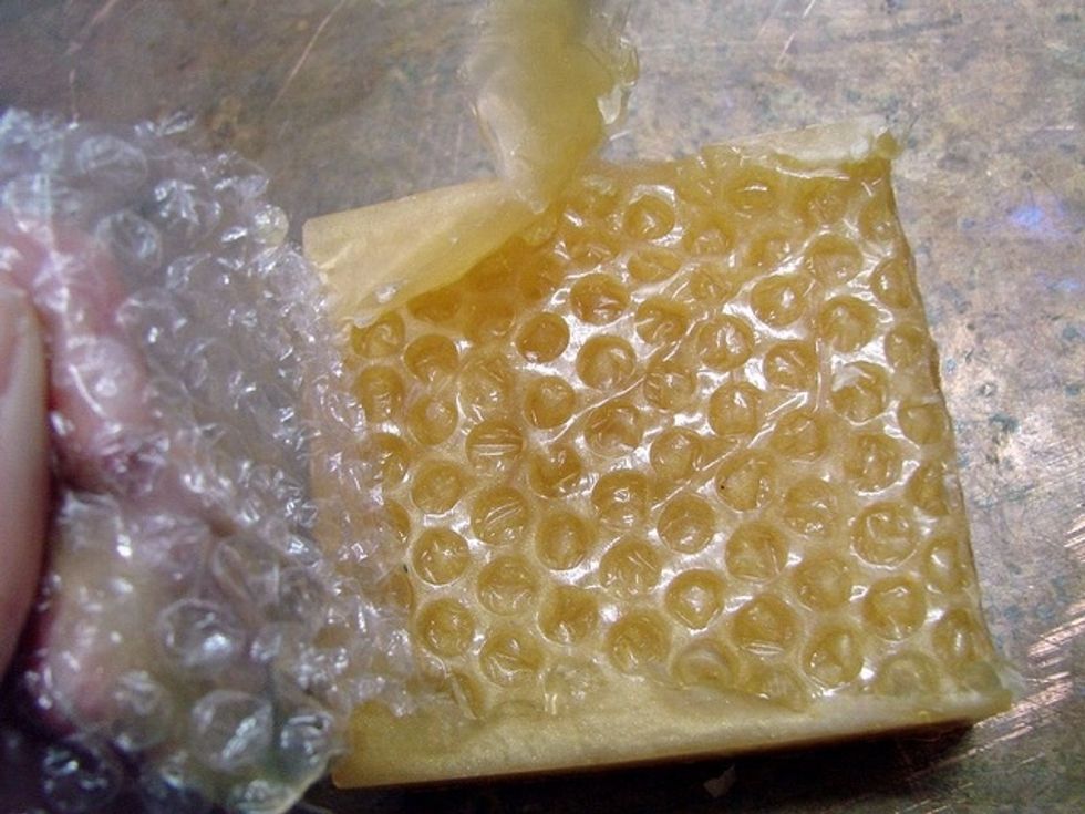 Let harden, remove soap from mold and peel back bubble wrap to reveal the textured surface.
