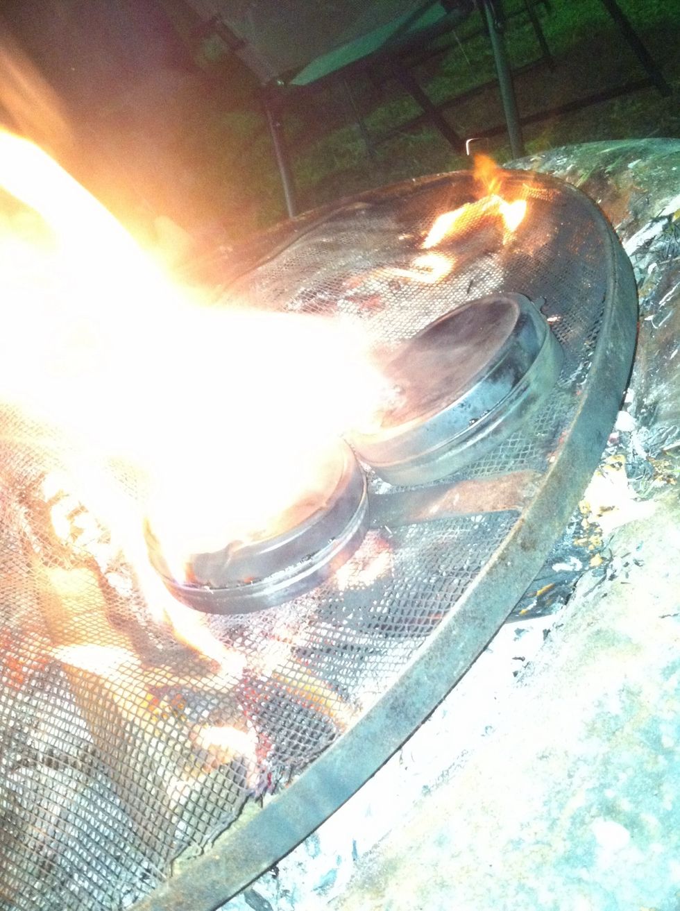 Let is fit on the fire for about 4 to 6 minutes or in tell the flames from the can stop , the flames are just the chemicals burning out