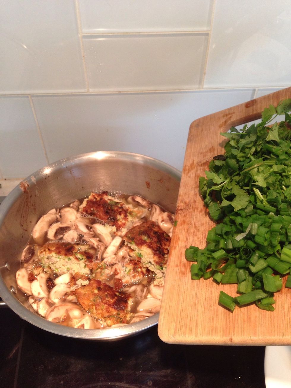 Let it boil then add green onion and cilantro. Season the soup with 1 tablespoon of fish sauce .