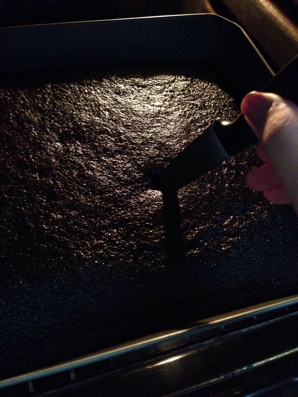 Let it cook and to know if it's cooked it will seem dry and to make sure stuck a knife inside it and if you pull it out with the mixture on it , it means that is not cooked