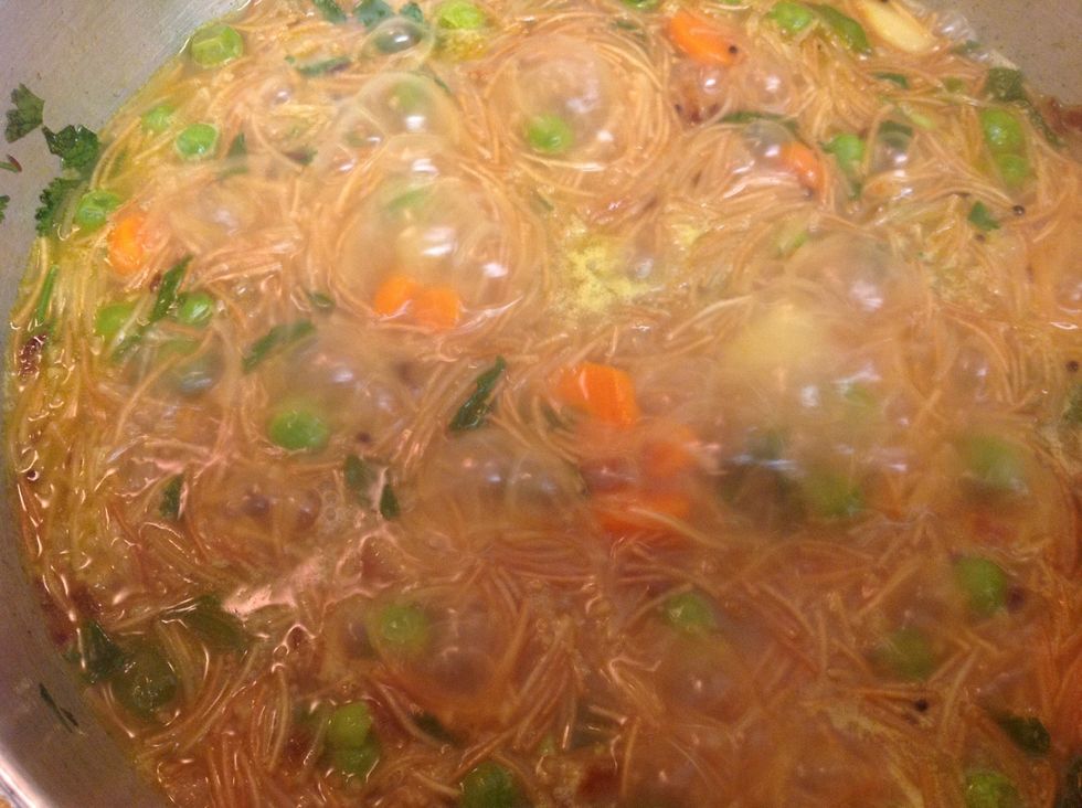 Let it cook till it soaks up most of the water and then cover and cook on a low flame