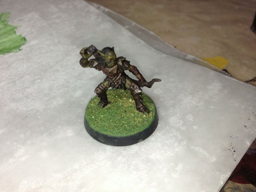 Let it dry overnight. If you apply paint to the base without letting it dry, the Green Stuff will soften and cause all kinds of problems.