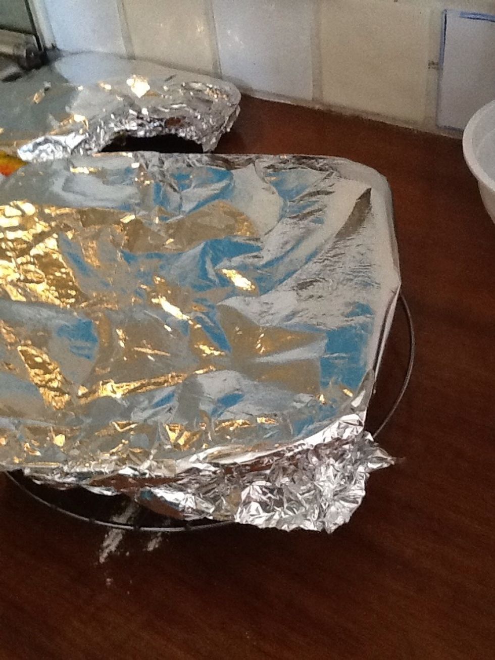 Let it rest and put your tin on a stand do it doesn't burn the table