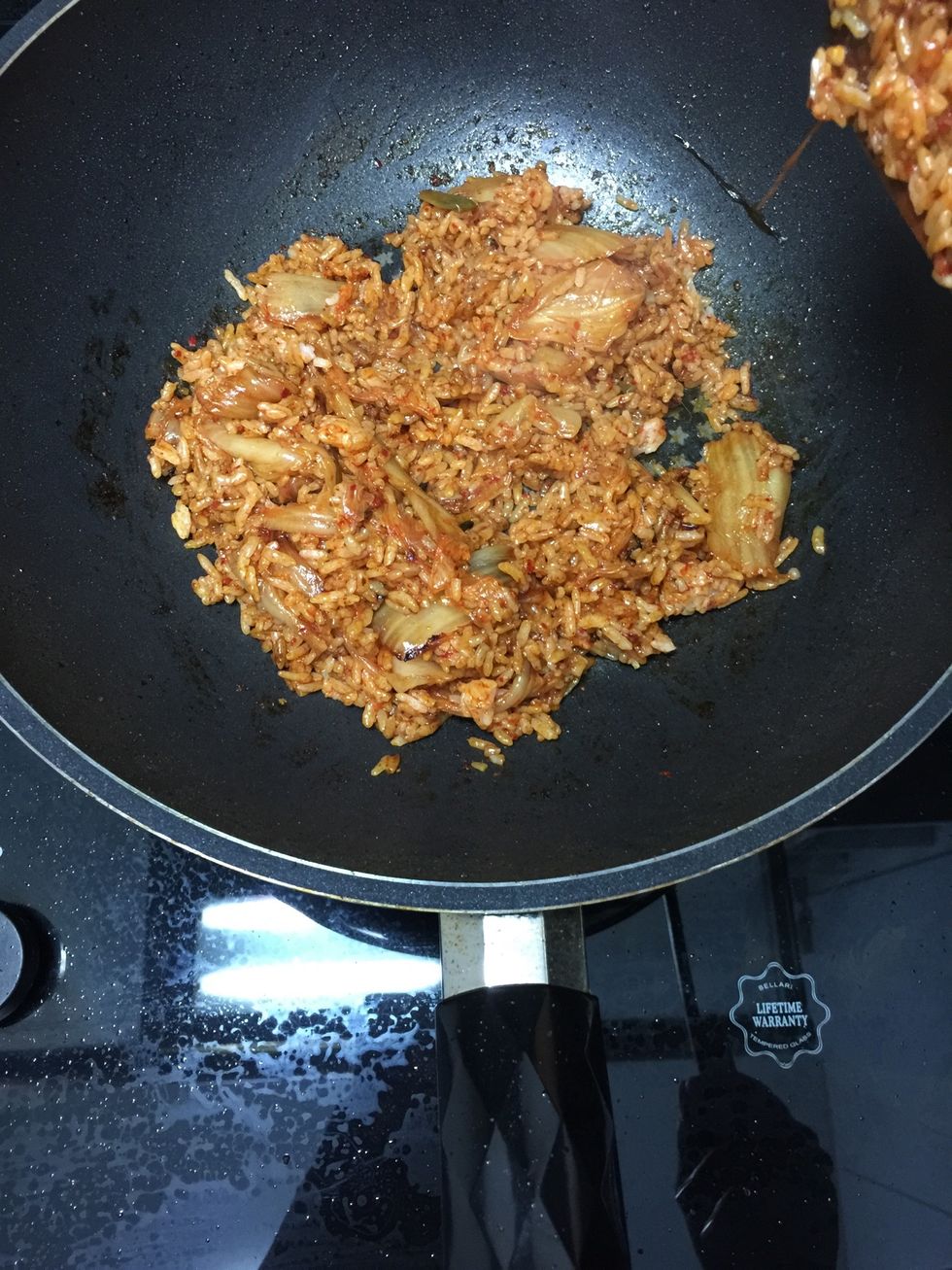 Let it sit on low heat for about 5 minutes. If you like it crispy on the bottom, you can spread the fried rice thinly over the pan and cook on low heat until the crispy bottoms if formed.