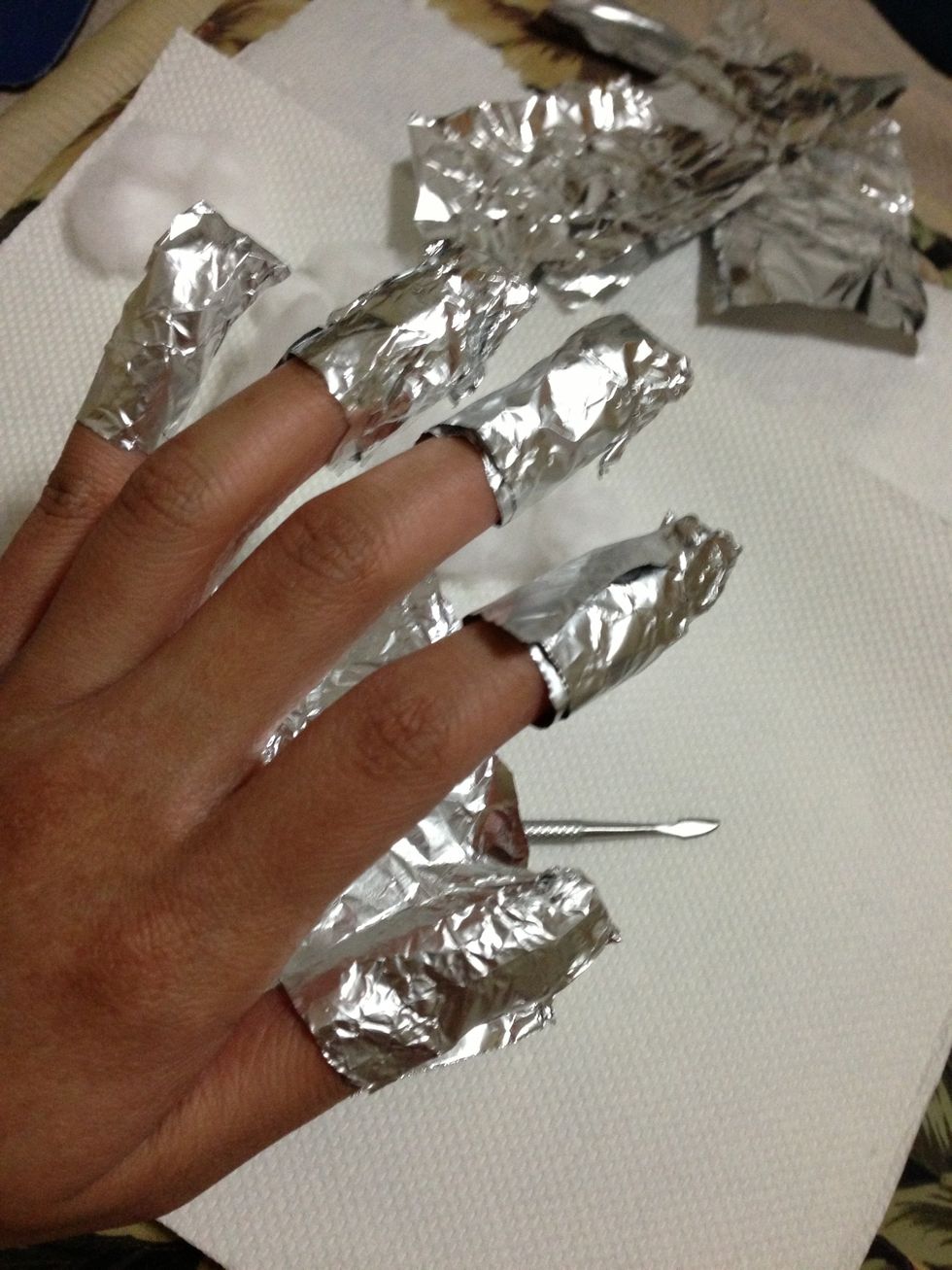 let it stand for about 10 minutes. This will make the polish soft. Easy to push with the nail pusher.