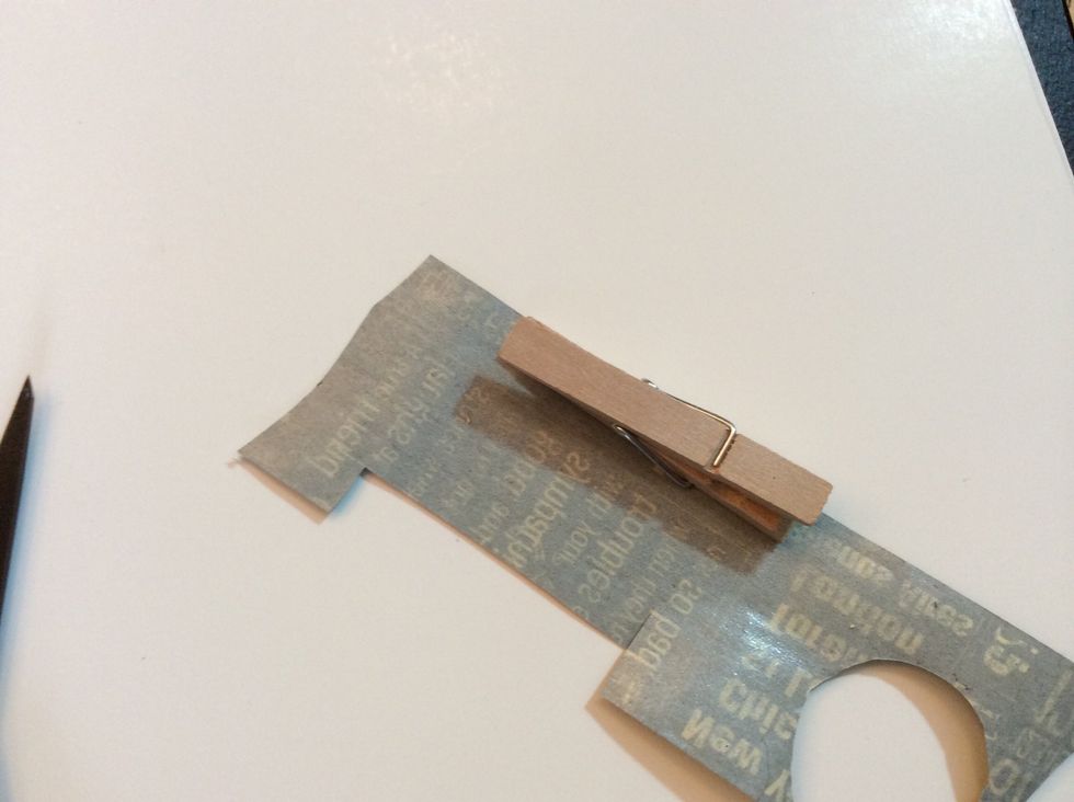 Let's a make a few clothespins to use on our wired pane...using Washi tape, cover clothespins. Trim excess.