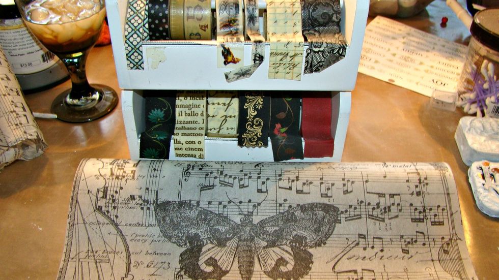 Let's decorate the accordian album. I wanted it simple so I chose some washi tape and Tim Holtz Tissue Wrap