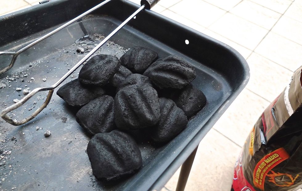 Let's get started by preparing the grill for INDIRECT HEAT. First place the charcoal briquettes on one side of the grill.