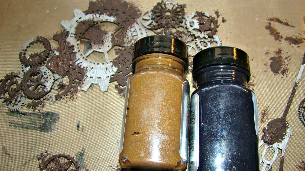 Let's give these pieces a rusty texture. Take the darkest brown you have. I added black to make it that much darker, mix together with craft sand that I purchased at the $1.00 store