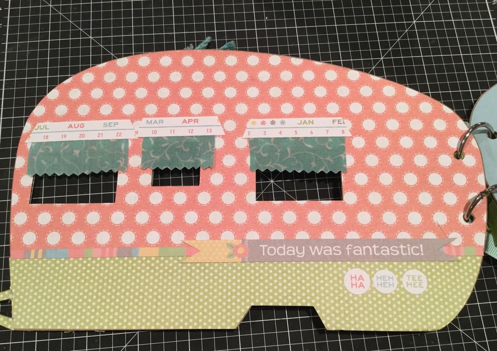 Let's go ahead and decorate the back cover. To separate the orange and green, you will use the color block sticker from your sticker sheet. Also use the Today was Fantastic sticker.