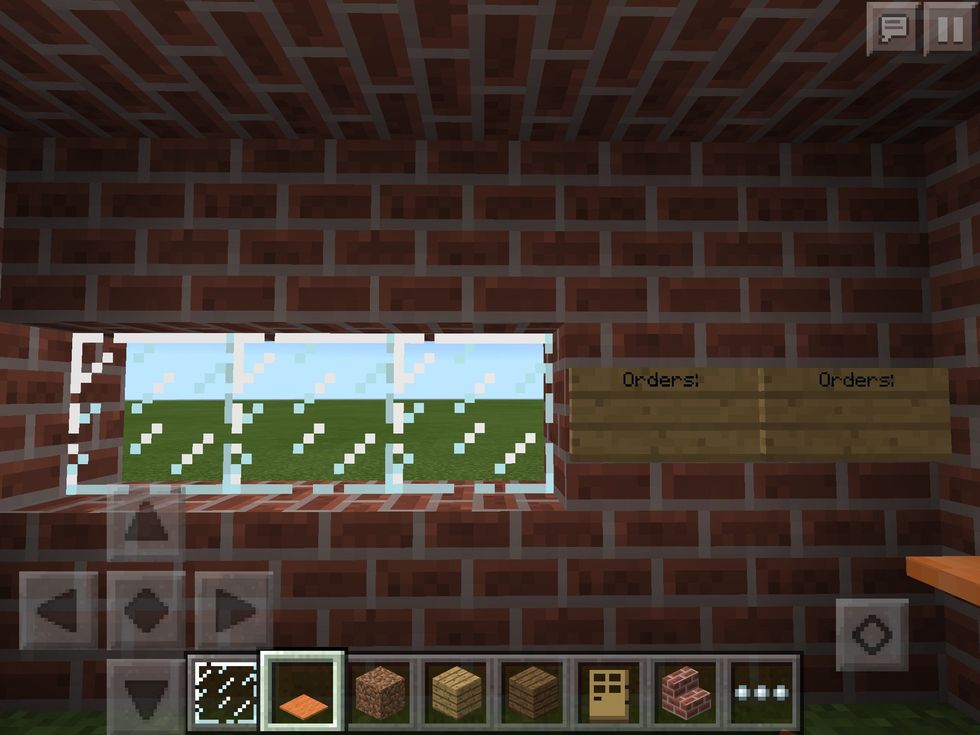 Let's go to the kitchen. Add some windows there too. I made that a drive through. Put some signs on the sides to make it look real. On the signs I wrote orders, but you can leave the signs if you want