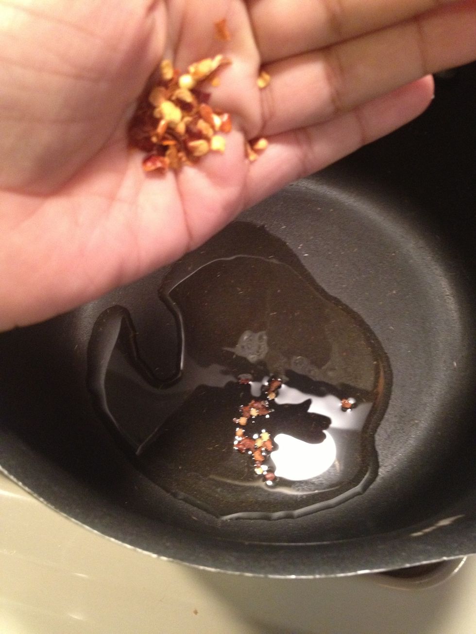 Let's kick it up a notch, add some pepper flakes and let this cook a minute or two. Do not burn it\ud83d\ude12