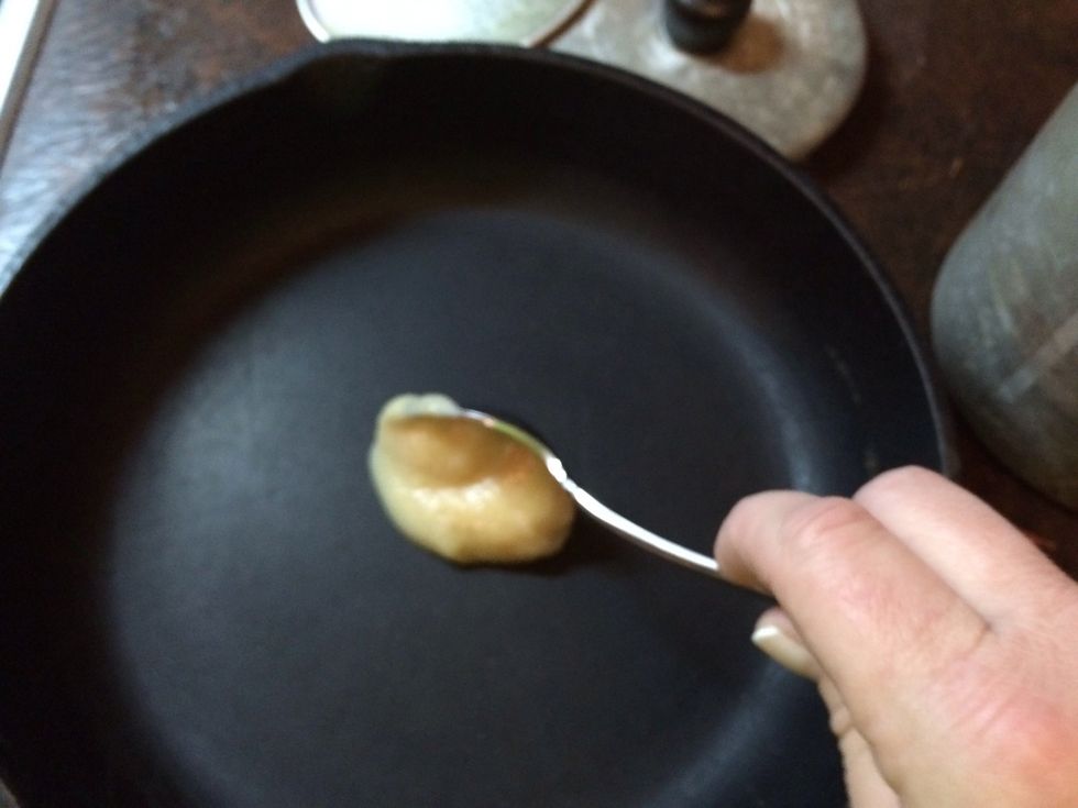Let's prepare the iron skillet for your cornbread, so it won't stick...Grab your iron skillet and dump 1 Tablespoon of fat (I'm using bacon grease) into the pan.