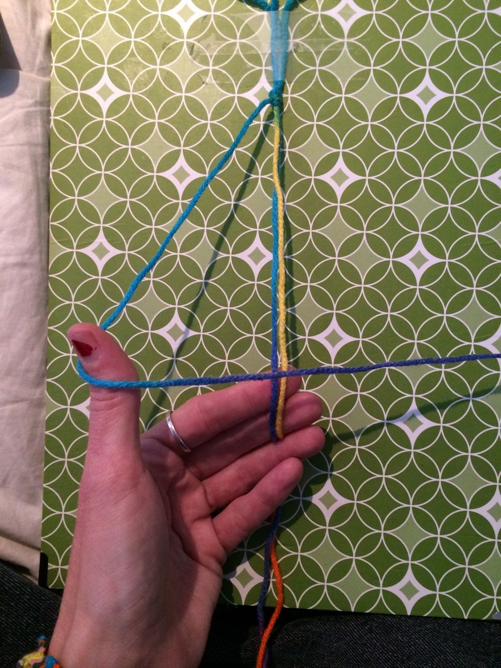 Let's repeat those steps and do it again :). Make a 4 with your string.