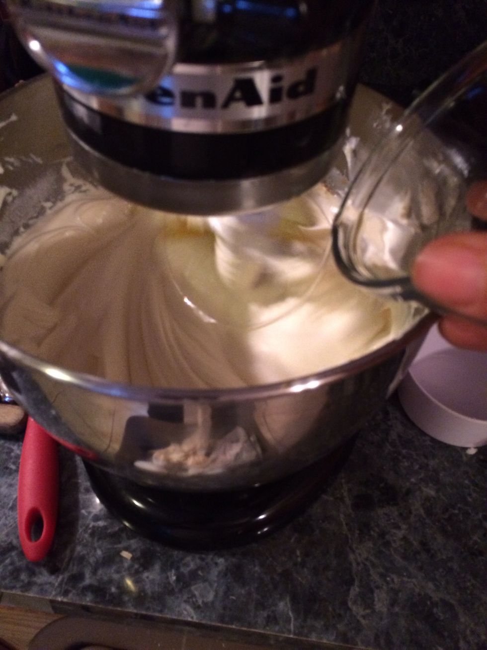 Let's start adding the eggs one at a time. Beat for a minute after each addition of egg.