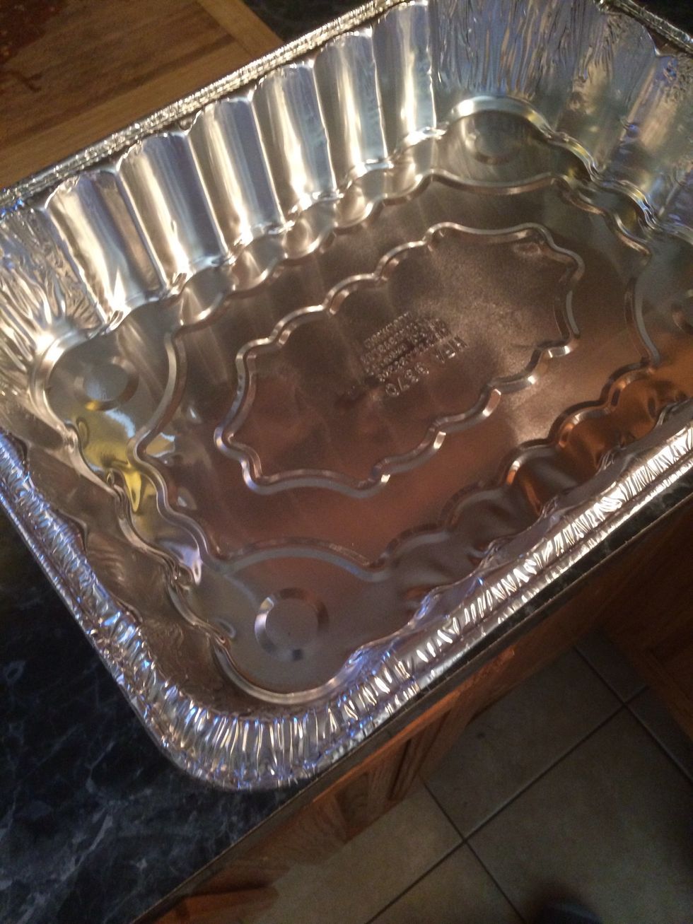 Let's start assembling our lasagna. Take your lasagna pan. Coat the bottom of the pan slightly with cooking spray(optional)