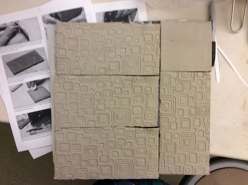 Let slabs set up by allowing them to dry evenly while flat until barely leather hard. Clay should be soft enough to join, but firm enough to stand up without support.