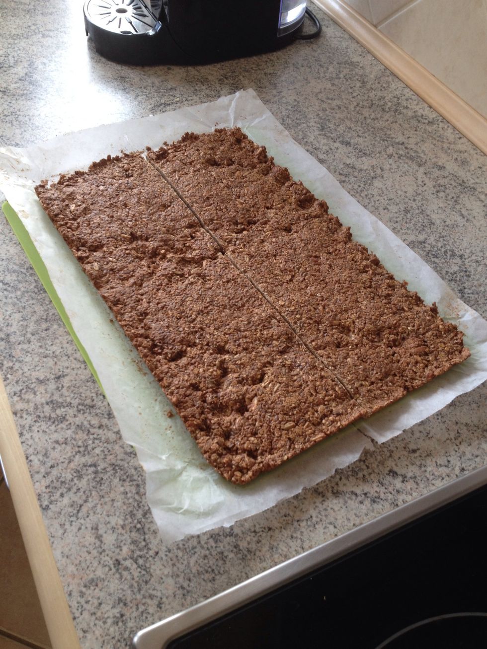 Let the bars cool completely (very important!) in the baking tray. Then add to a cutting board