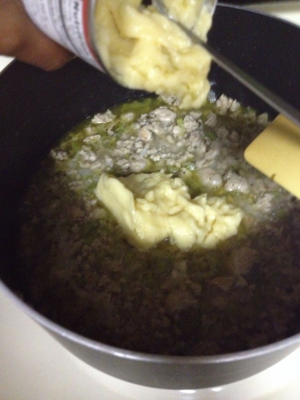 Let the broth come to a boil, then add the Cream of Celery soup.