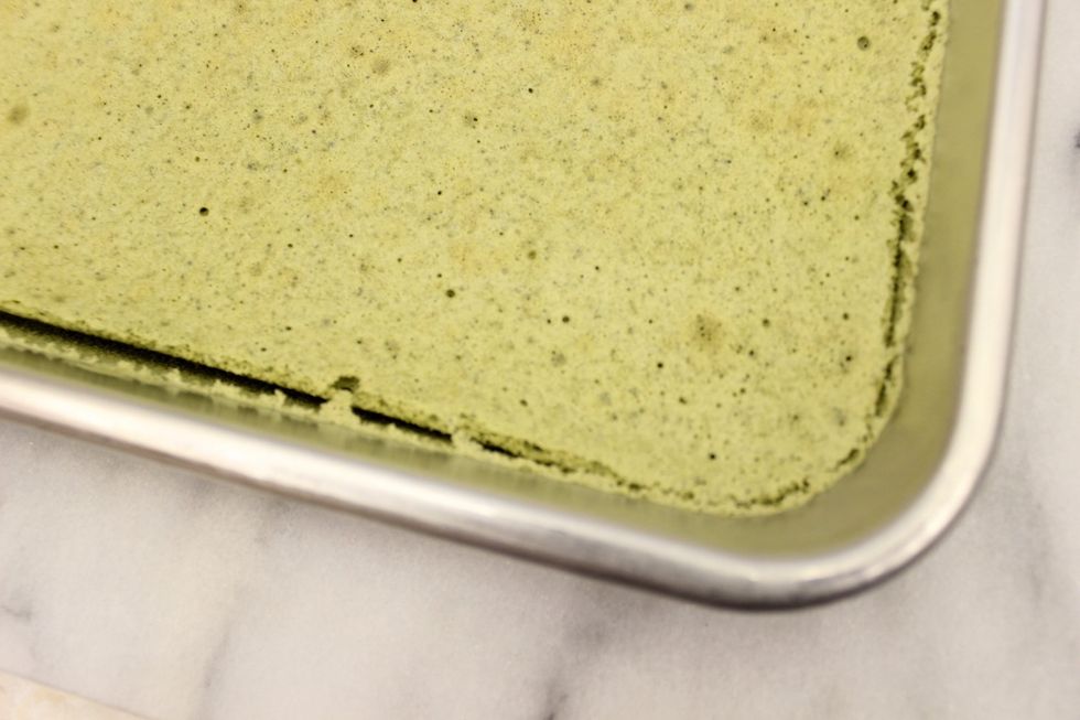 Let the cake cook in its pan for 10 minutes on a cooling rack. As the cake cools, you'll see the cake pull away from the edges of the pan.