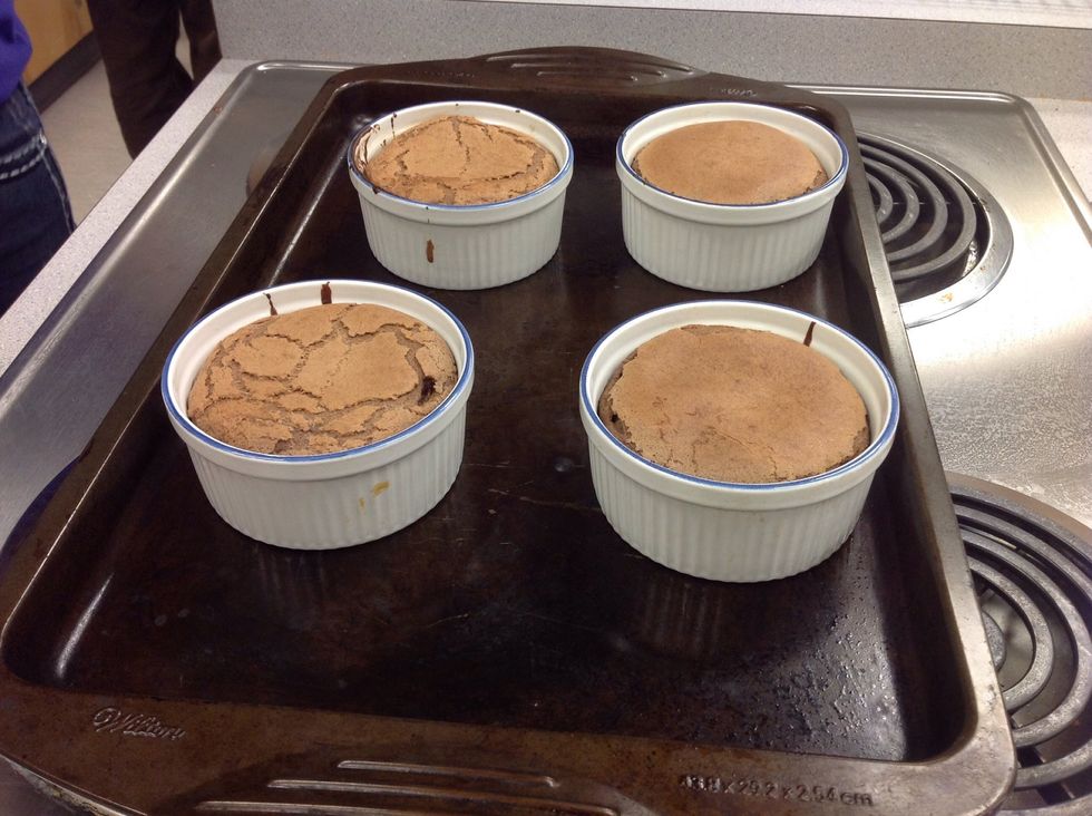Let the cakes sit for 1 minute to cool. Run a small knife or spoon around cakes to loosen. Carefully invert cakes into dessert dishes.