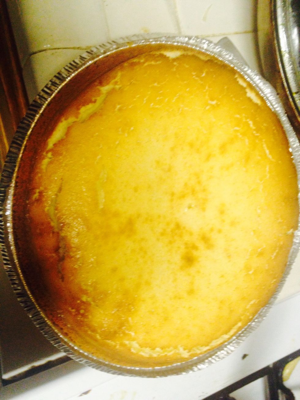 Let the cheesecake cool down and deflate before adding anything else