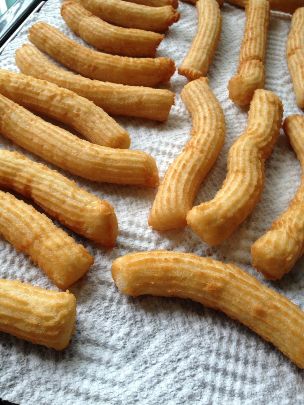 Let the churros dry and cool on paper towels.