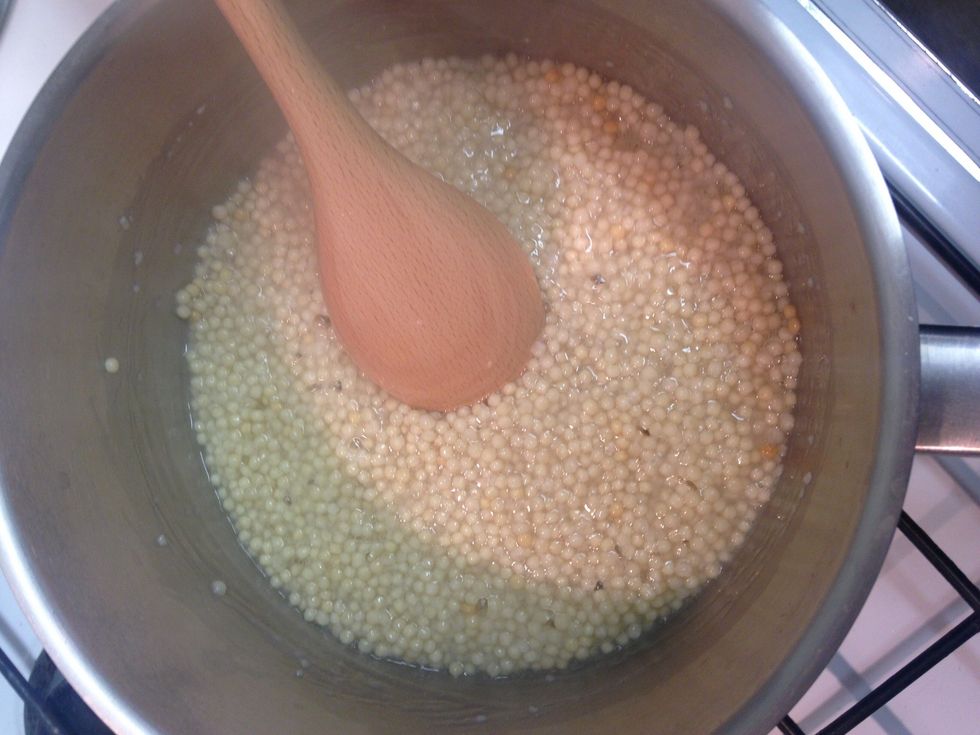 Let the cous cous soak up at low to medium heat