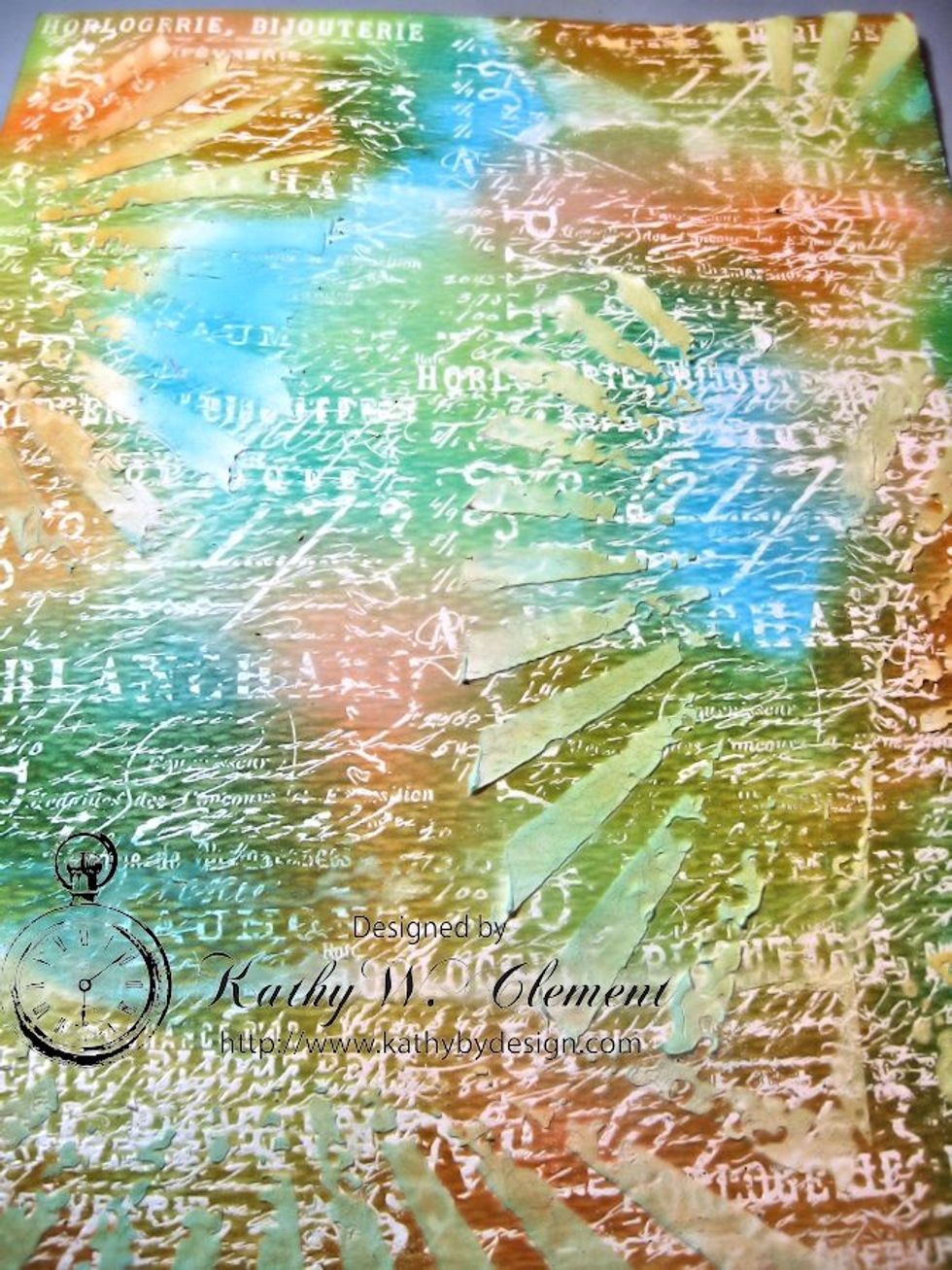 Let the crackle paste dry overnight, or dry carefully with a heat tool Spritz with a water bottle and flick water with your fingers to further blend and distress the background. .