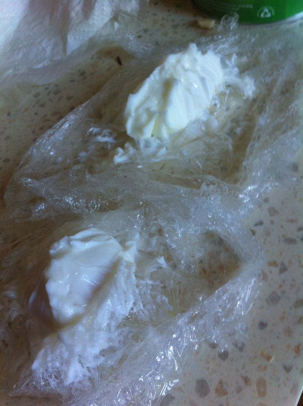 Let the egg(s) cool down a little before opening up the cling wrap, it is a good idea to place them (when in wrap) onto paper towel so that water doesn't go everywhere