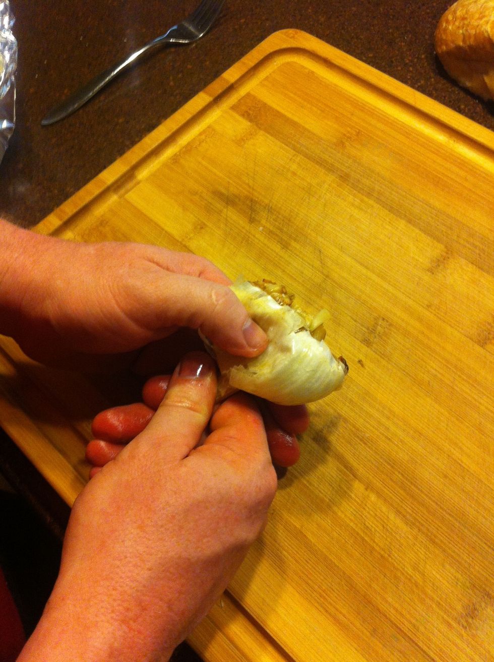 Let the garlic cool slightly, then gently squeeze the cloves out.