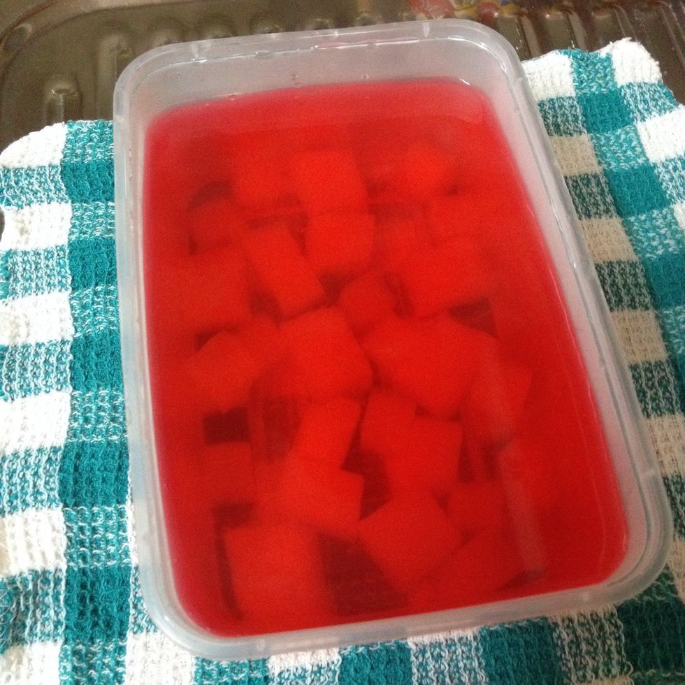 Let the jelly mixture and the cubes settle down and let it cool off a bit before placing it in the fridge.