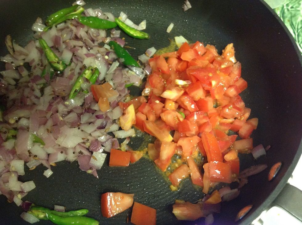Let the onions cook a little and add tomatoes