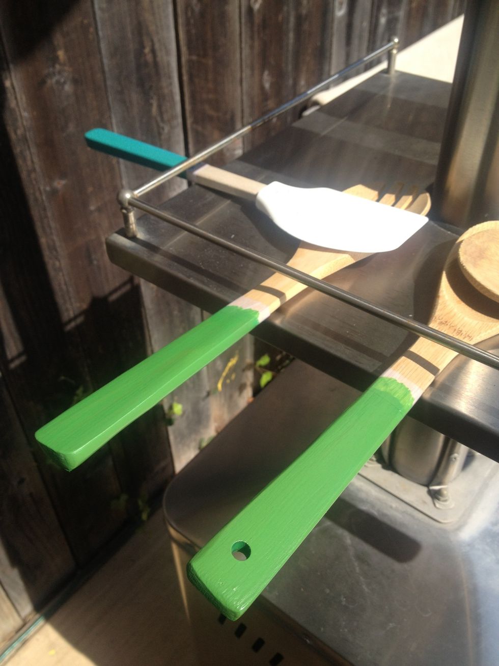 Let the spray paint dry in the sun until it is moderately dry, than spray another coat.