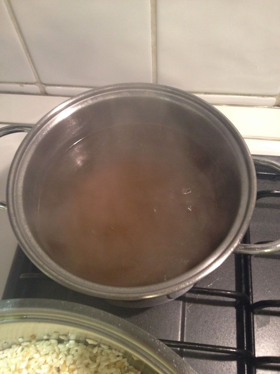 Let the vegetable broth boil and add some of in in the rice