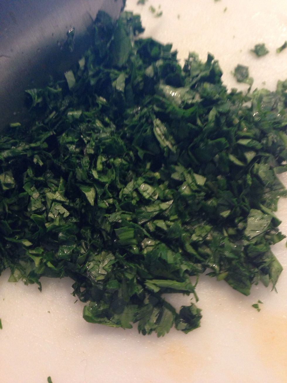Let the vegetables cool.  Rinse your cilantro and squeeze out the excess water. I like to chop my cilantro finely, but you can chop it any way you wish.