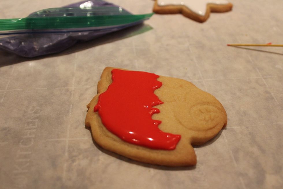 Let this icing dry before icing the rest of your cookie
