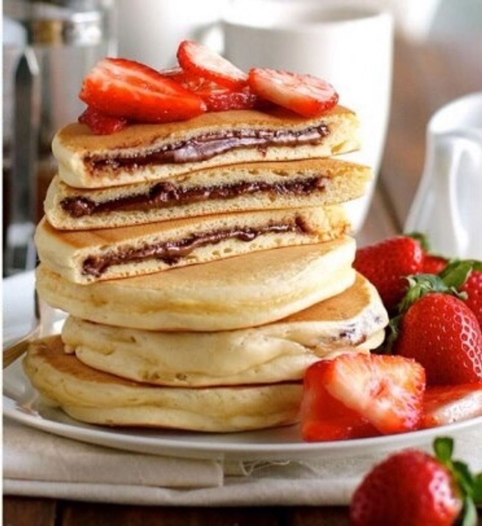 Let you're delicious oozy pancakes cool down for 1 minute. Now kick your feet up and enjoy your Nutella stuffed pancakes.